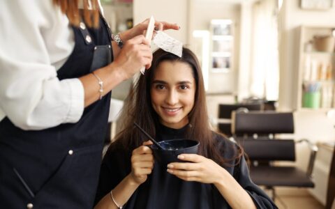 hairdresser-makes-hairstyle-to-female-customer-SAD5VL2.jpg